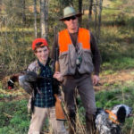 Our guide, Jonathan Enfinger, with a young hunter showing off his pheasant on a hunt in Mobile, AL